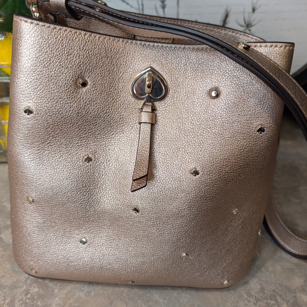 Kate Spade Marti Stud Small Bucket Bag in metallic rose gold. 